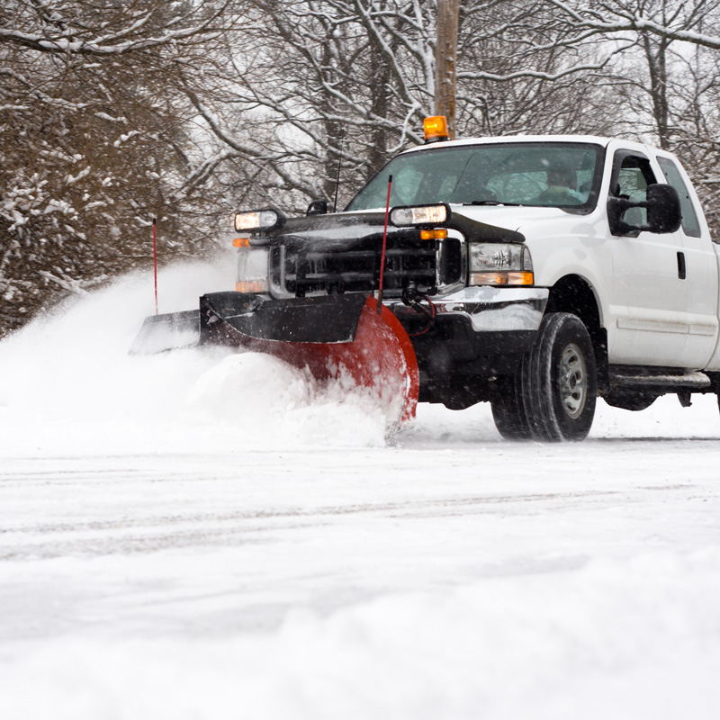 truck pushing snow